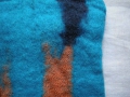Stulpen für die Hände aus 100% Wolle, gefilzt, orange-türkis-blau, detail